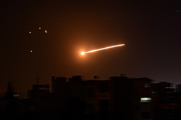 A handout picture released by the official Syrian Arab News Agency (SANA) on February 24, 2020, reportedly shows Syrian air defence intercepting an Israeli missile in the sky over the Syrian capital Damascus. [File: AFP]