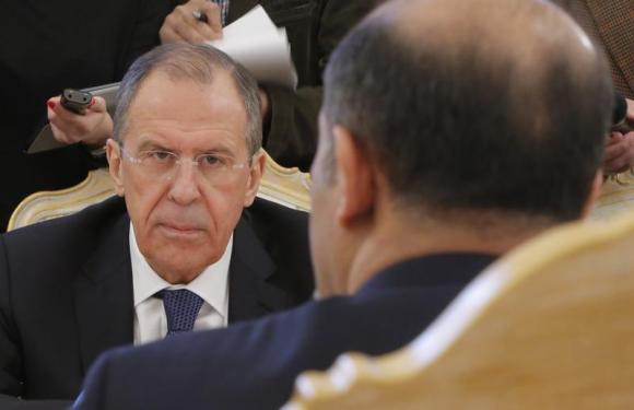 Russia’s FM Lavrov listens during a meeting with Syrian opposition leader Ahmad Jarba in Moscow