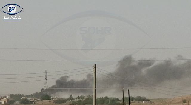 تصاعد سحب الدخان نتيجة القصف التركي على ريف ناحية أبو راسين
